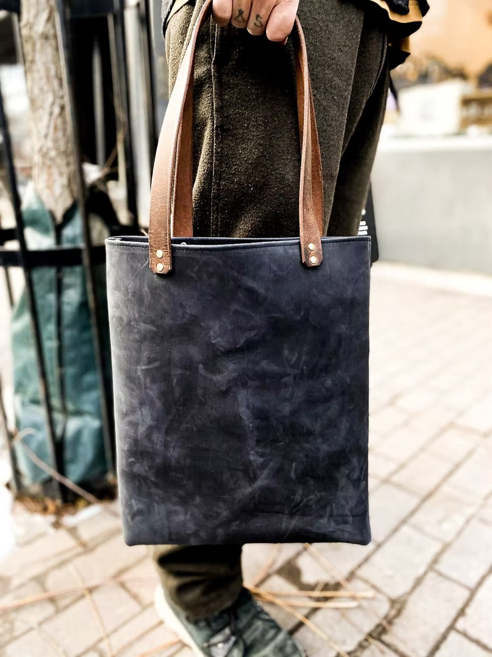 In blue Navy Leather Messenger Tote with Brown Handles